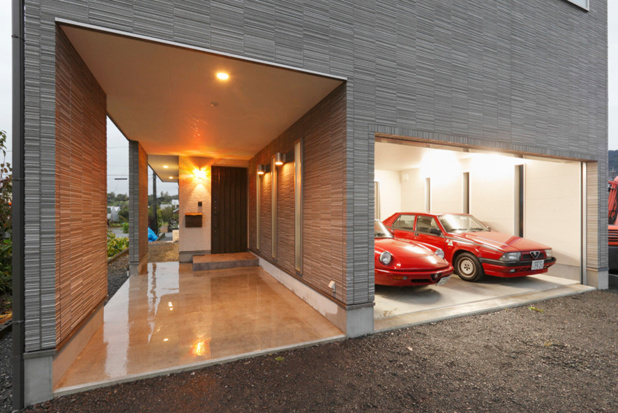 This is an example of a large modern two-car garage in Other.