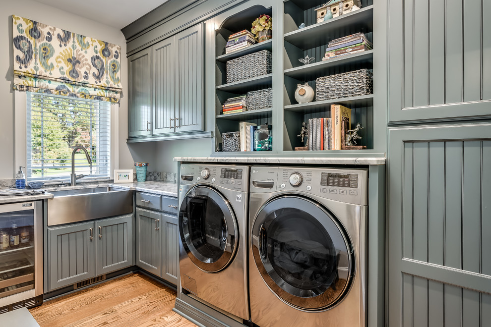 Large arts and crafts u-shaped laundry room in DC Metro with shaker cabinets, white cabinets, granite benchtops and dark hardwood floors.