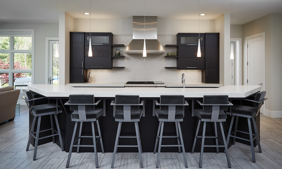 This is an example of a modern single-wall home bar in Grand Rapids with white splashback, grey floor, dark wood cabinets, marble splashback, ceramic floors and white benchtop.