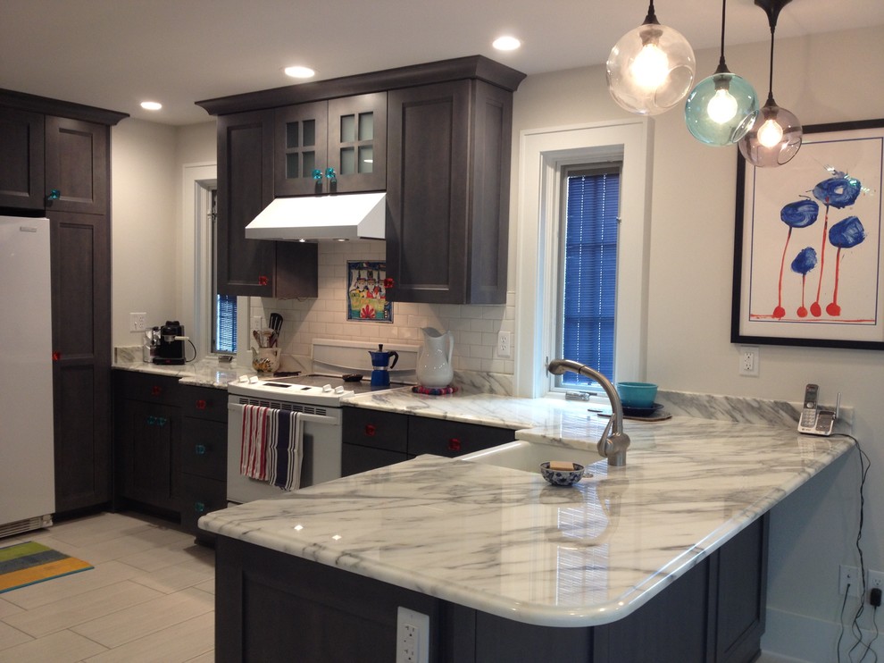 Eat-in kitchen - large transitional u-shaped porcelain tile eat-in kitchen idea with a farmhouse sink, flat-panel cabinets, gray cabinets, marble countertops, white backsplash, ceramic backsplash, white appliances and no island