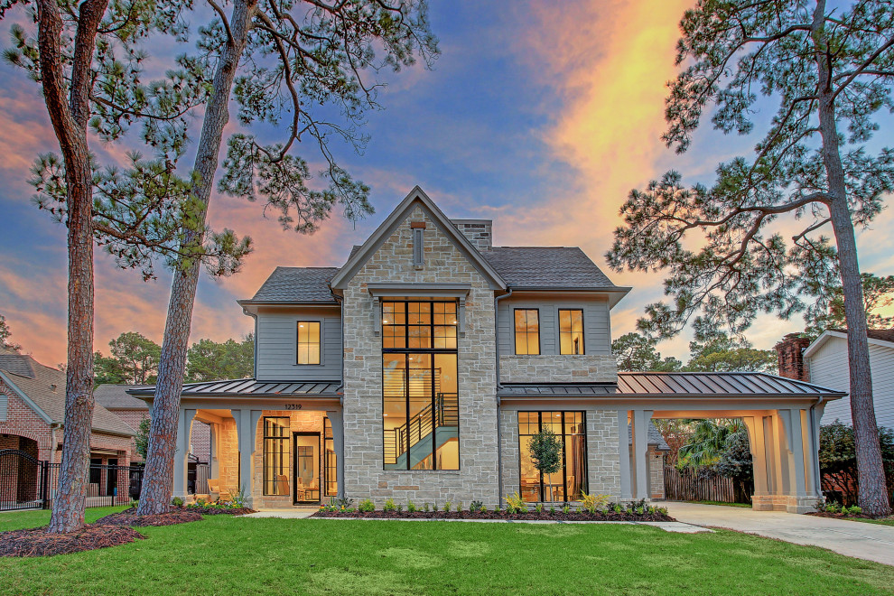 Expansive contemporary two-storey beige house exterior in Houston with stone veneer, a mixed roof and a brown roof.