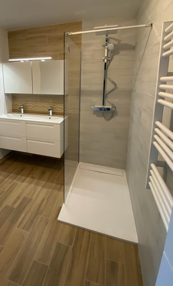 Inspiration for a mid-sized modern master bathroom in Nice with glass-front cabinets, white cabinets, a curbless shower, a two-piece toilet, gray tile, wood-look tile, wood-look tile, a console sink, solid surface benchtops, brown floor, an open shower, white benchtops, a double vanity and a floating vanity.
