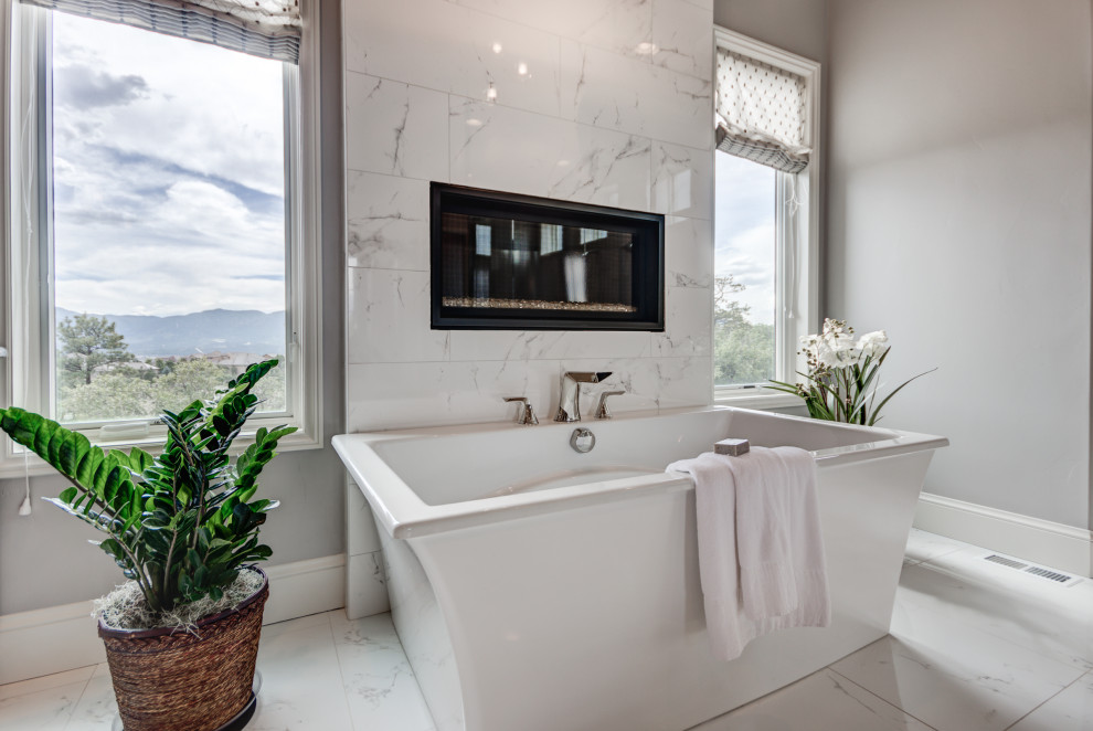 Example of a transitional home design design in Denver