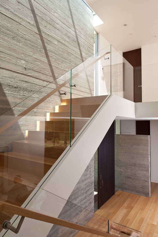 This is an example of a modern wood staircase in San Francisco with wood risers.