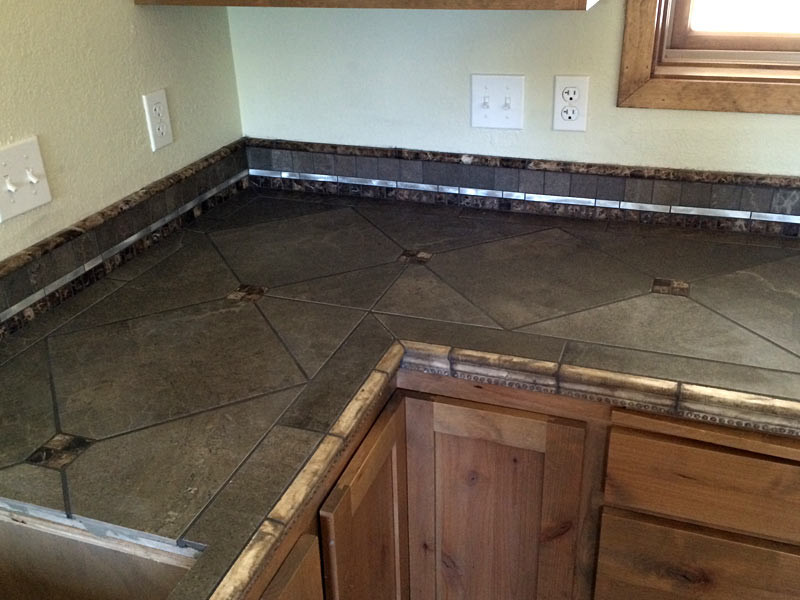 Kitchen - kitchen idea with medium tone wood cabinets and tile countertops