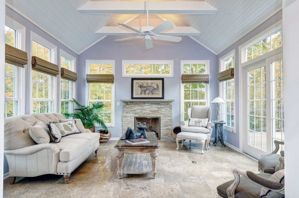 Design ideas for a small traditional sunroom in Columbus with travertine floors, a stone fireplace surround and a standard ceiling.