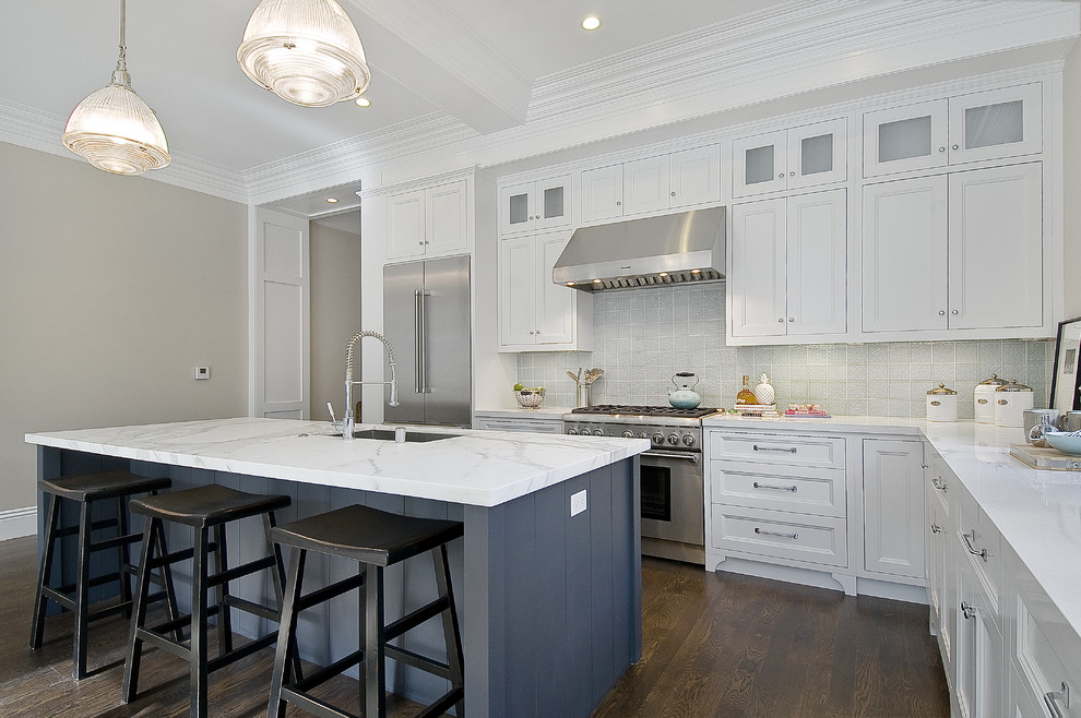 Photo of a traditional kitchen in San Francisco with recessed-panel cabinets, stainless steel appliances, white cabinets, marble benchtops and grey benchtop.