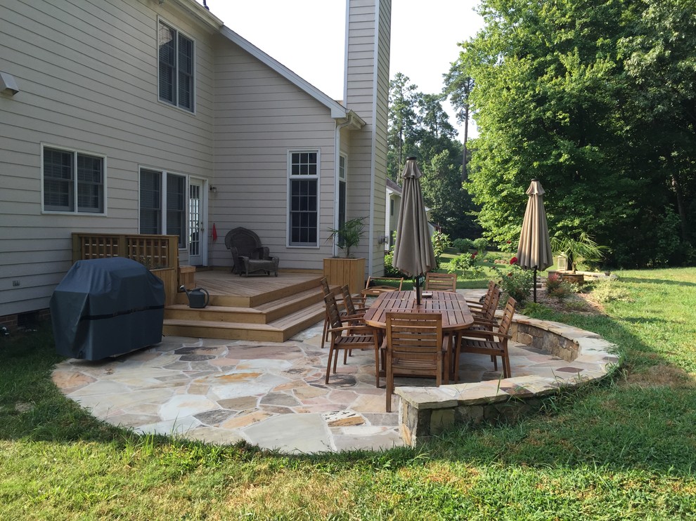 Photo of a mid-sized traditional backyard deck in Raleigh with a fire feature and no cover.
