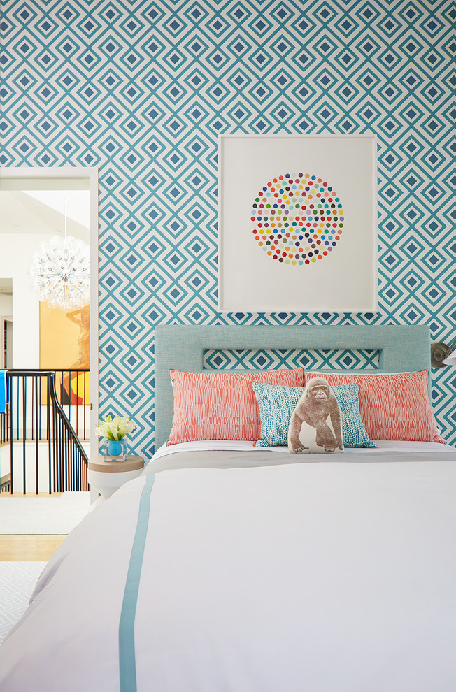 This is an example of a mid-sized transitional kids' room for girls in San Francisco with multi-coloured walls, light hardwood floors and beige floor.