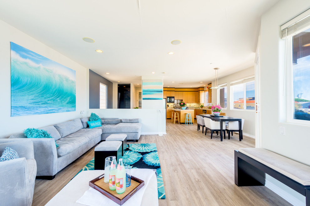 Living room - coastal light wood floor living room idea in Los Angeles with white walls