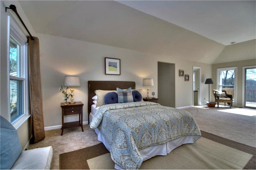 Inspiration for a large traditional master bedroom in Atlanta with beige walls, carpet and beige floor.