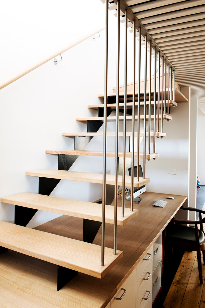 Inspiration for a mid-sized scandinavian wood u-shaped staircase in Melbourne with wood risers.