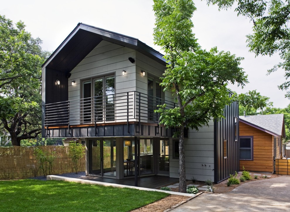 Photo of a contemporary exterior in Austin with metal siding and a gable roof.