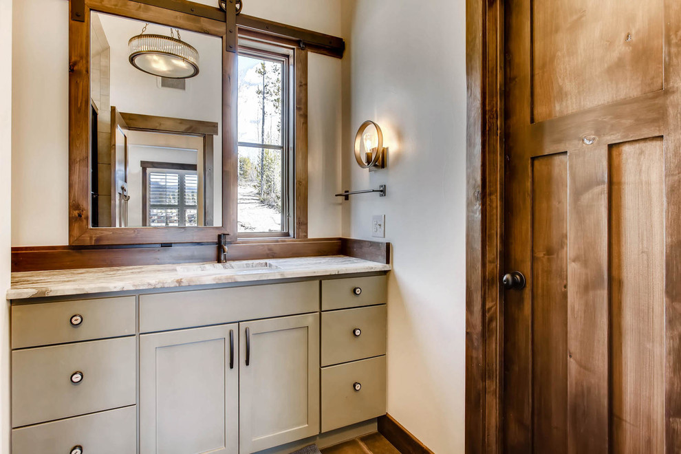 Design ideas for a small country master bathroom in Denver with shaker cabinets, green cabinets, brown tile, porcelain tile, an undermount sink and granite benchtops.
