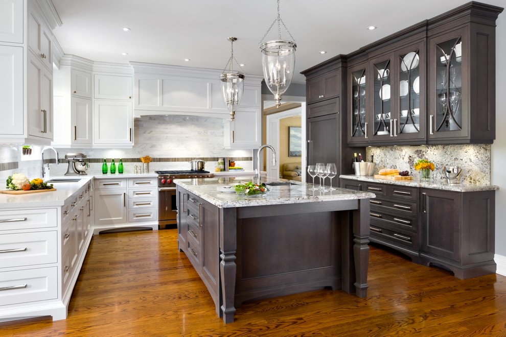 This is an example of a transitional u-shaped separate kitchen in Toronto with a double-bowl sink, shaker cabinets, white cabinets, white splashback and panelled appliances.