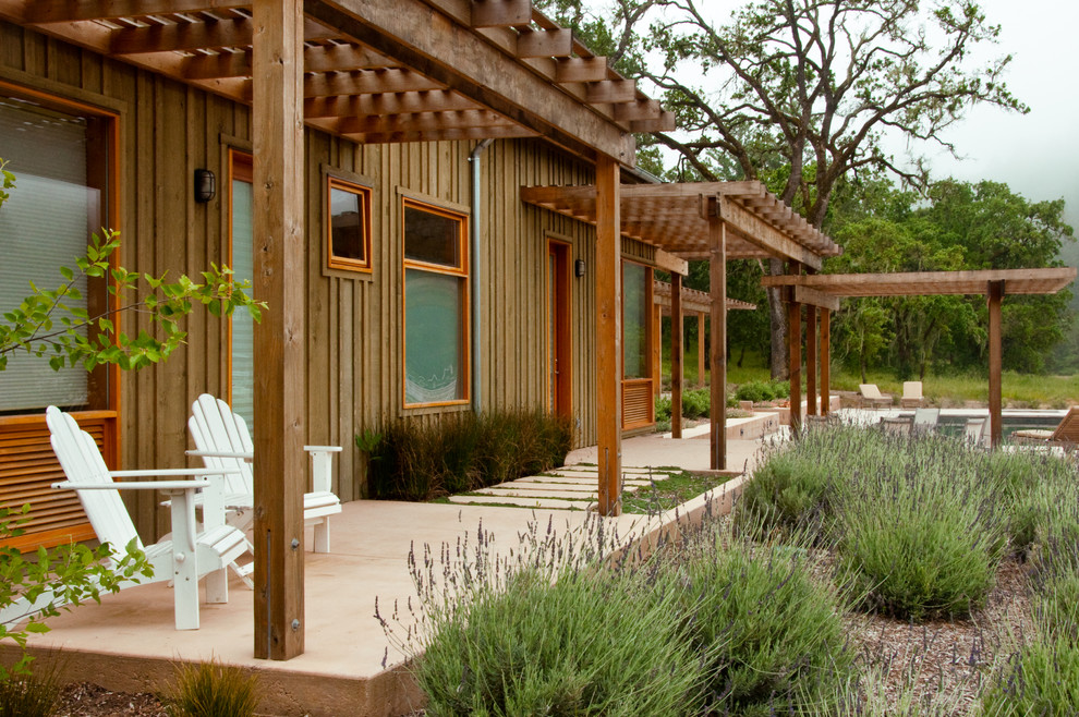 This is an example of a country backyard verandah in San Francisco with a pergola.