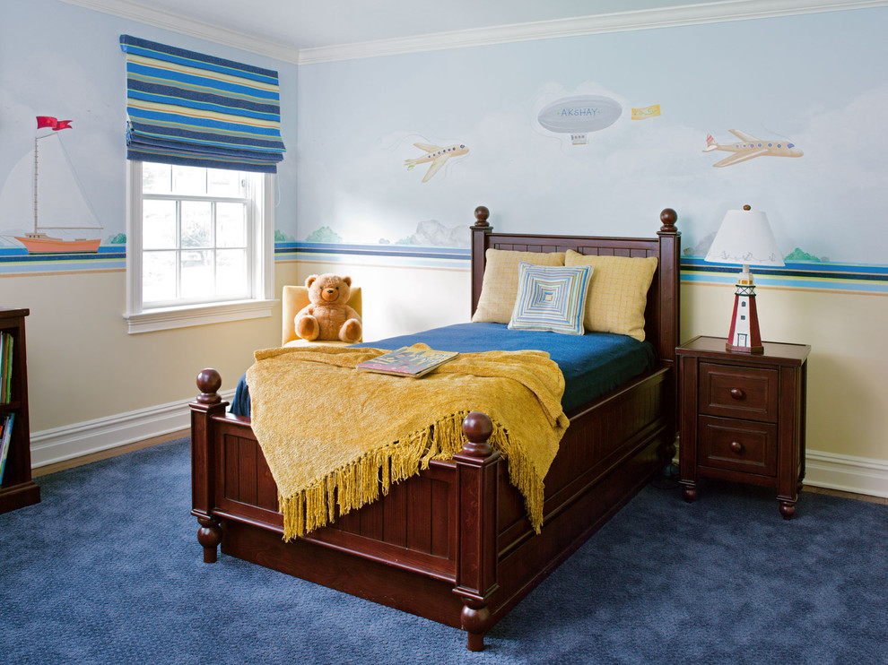 This is an example of a traditional kids' room for boys in New York with multi-coloured walls, carpet and blue floor.