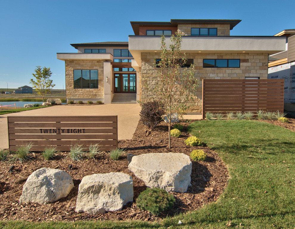 Contemporary two-storey exterior in Other with stone veneer.