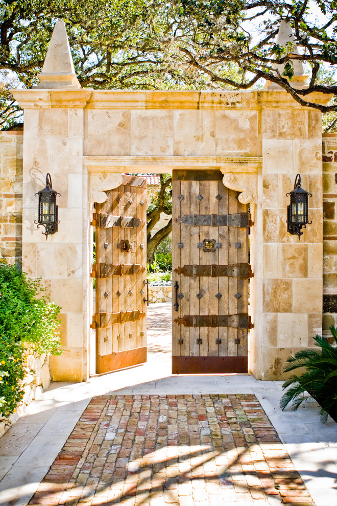 This is an example of a mediterranean garden in Austin with a garden path.
