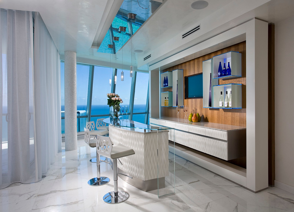 Large contemporary galley seated home bar in Miami with no sink, white cabinets, white floor and flat-panel cabinets.