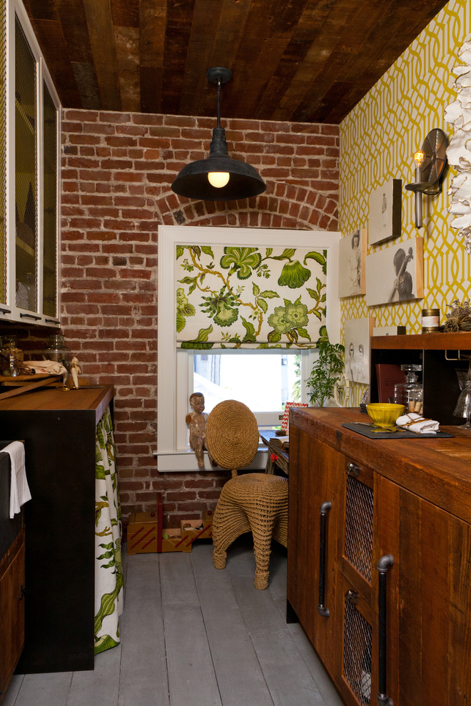 This is an example of a country laundry room in San Francisco with yellow walls.