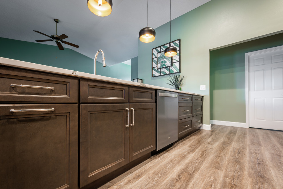 Example of a huge transitional single-wall vinyl floor and gray floor eat-in kitchen design in Orlando with an undermount sink, recessed-panel cabinets, gray cabinets, quartz countertops, white backsplash, porcelain backsplash, stainless steel appliances, an island and white countertops