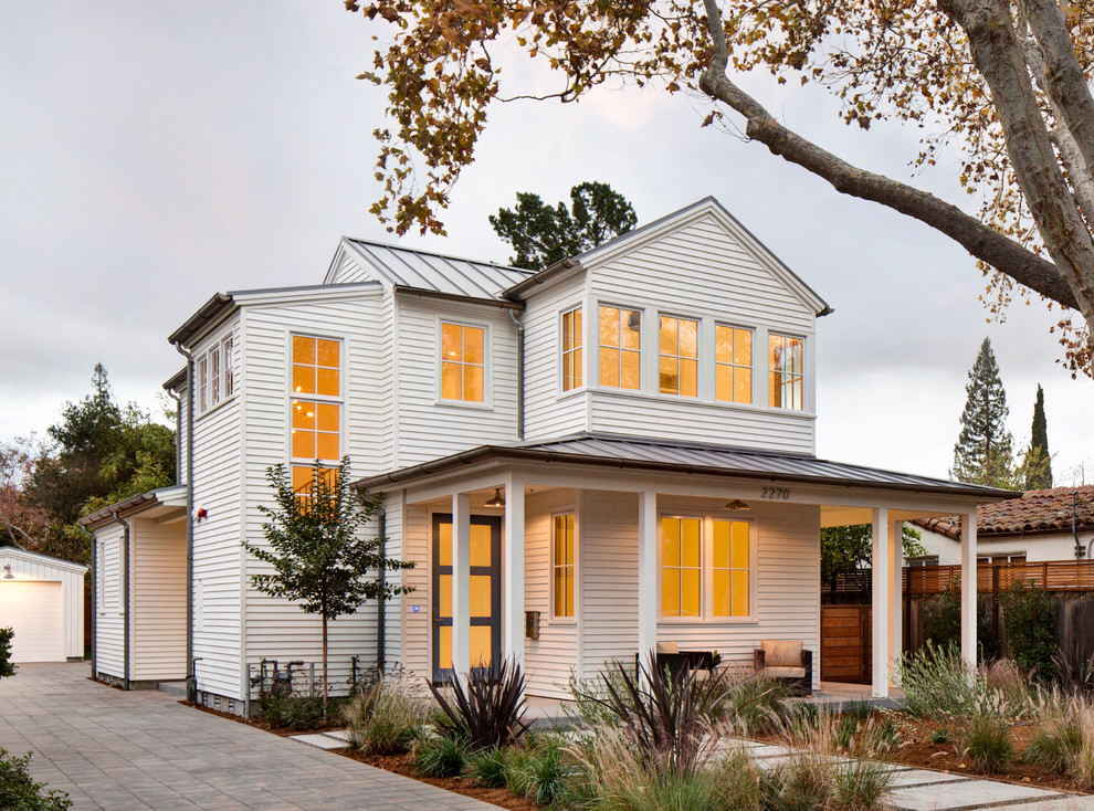 Inspiration for a mid-sized country two-storey white exterior in San Francisco with a gable roof.