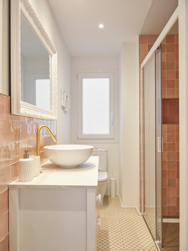 This is an example of a small scandinavian master bathroom in Other with white cabinets, a curbless shower, pink tile, ceramic tile, multi-coloured walls, porcelain floors, a console sink, tile benchtops, grey floor, a sliding shower screen, white benchtops, a single vanity and a freestanding vanity.