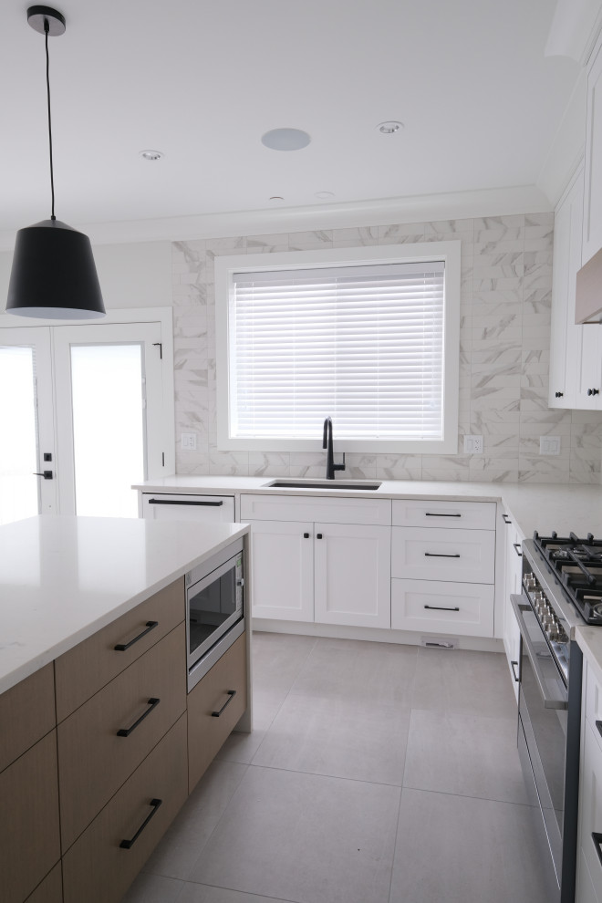 Example of a transitional kitchen design in Vancouver