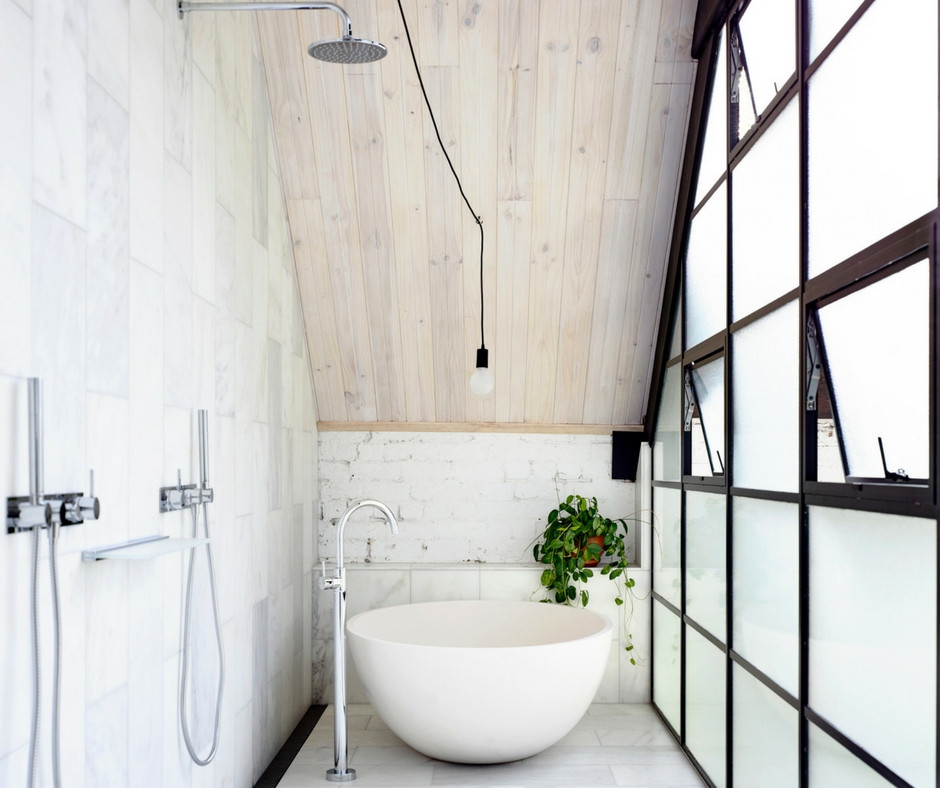 Inspiration for an industrial wet room bathroom in Melbourne with a freestanding tub and an open shower.