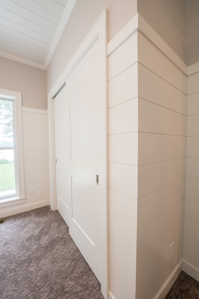 This is an example of a small country hallway in Minneapolis with grey walls, carpet and grey floor.