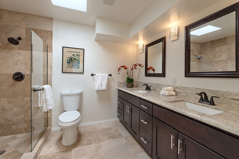 Mid-sized midcentury bathroom in Other with an undermount sink, granite benchtops, an open shower, a two-piece toilet, beige tile, stone tile, white walls and travertine floors.