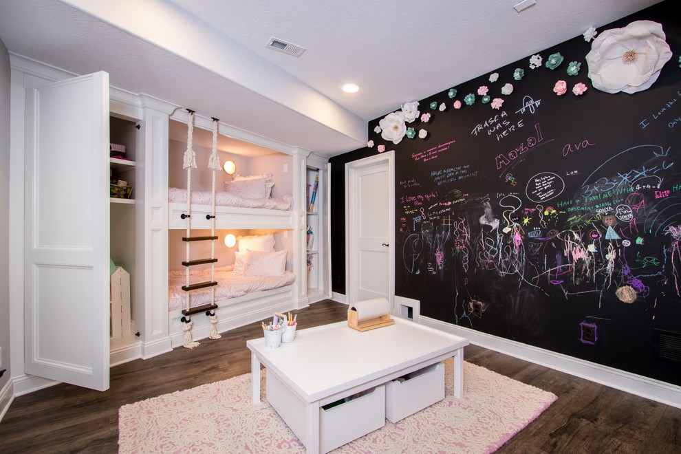 Fun Family Basement Renovation - Example of a bedroom transitional dark wood floor and brown floor kids' bedroom design in Cleveland with black walls