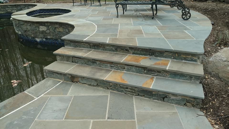 Huge transitional backyard stone and kidney-shaped natural pool photo
