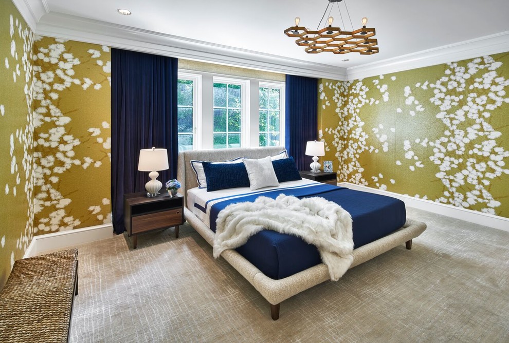 This is an example of a large transitional guest bedroom in New York with yellow walls, carpet and beige floor.
