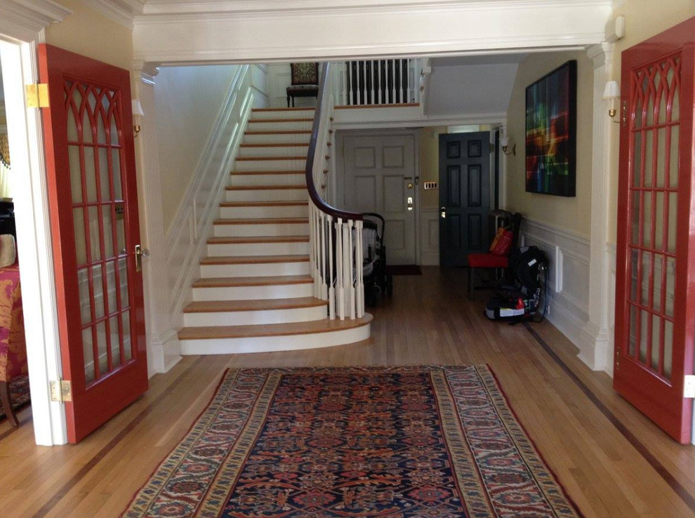 Design ideas for a mid-sized traditional foyer in Baltimore with beige walls and medium hardwood floors.