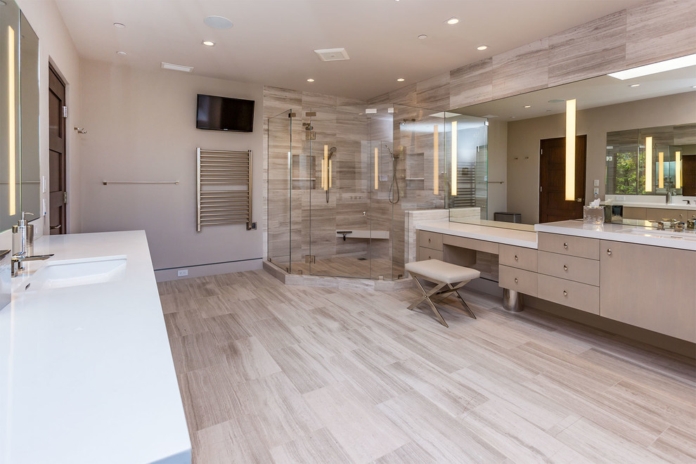 This is an example of a large contemporary master bathroom in Los Angeles with flat-panel cabinets, grey cabinets, an undermount tub, a double shower, a bidet, porcelain tile, beige walls, porcelain floors, an undermount sink, engineered quartz benchtops, grey floor, an open shower and white benchtops.