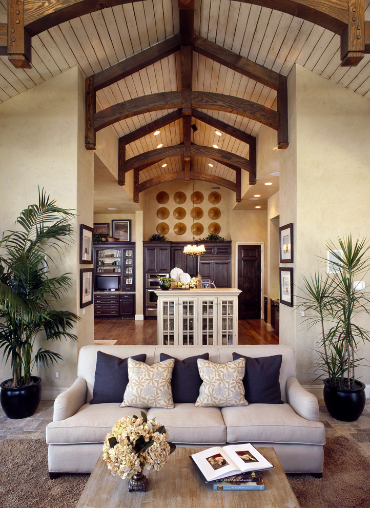 Inspiration for a traditional open concept family room in Denver with beige walls.