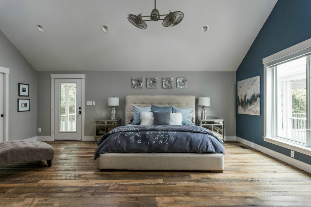 Contemporary master bedroom in Indianapolis with light hardwood floors.