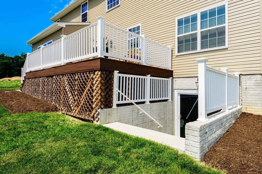 Deck - mid-sized transitional backyard deck idea with no cover