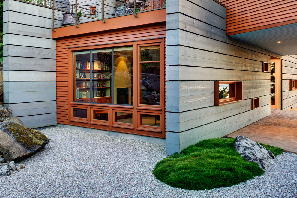 Design ideas for a contemporary split-level grey exterior in Seattle with wood siding.