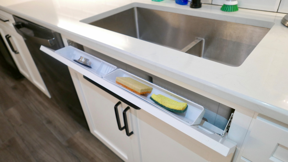 Eat-in kitchen - mid-sized transitional galley porcelain tile and gray floor eat-in kitchen idea with an undermount sink, shaker cabinets, white cabinets, quartz countertops, white backsplash, subway tile backsplash, black appliances, no island and white countertops