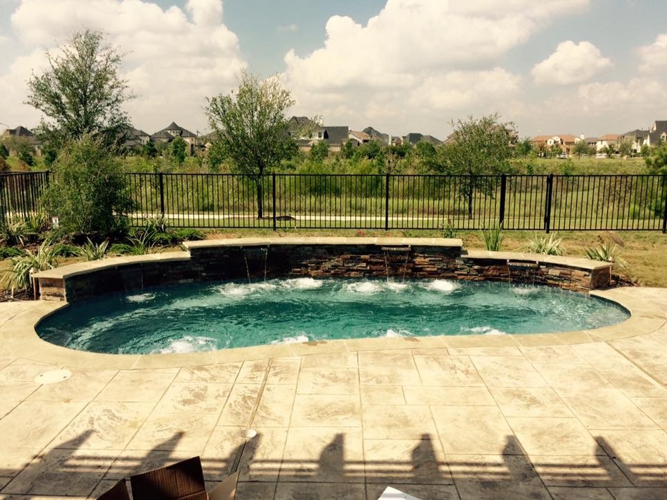Example of a mountain style pool design in Houston