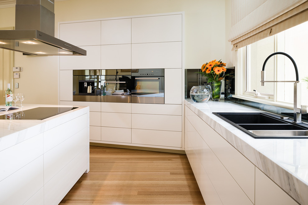 Modern kitchen in Melbourne with marble benchtops.