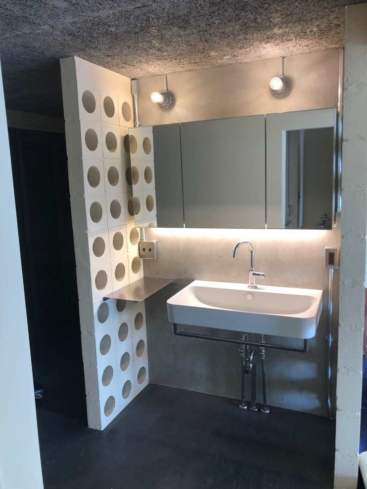 Inspiration for a small modern cloakroom in Tokyo with white cabinets, grey tiles, cement tiles, grey walls, concrete flooring, a wall-mounted sink, stainless steel worktops, grey floors, a freestanding vanity unit, a timber clad ceiling and tongue and groove walls.