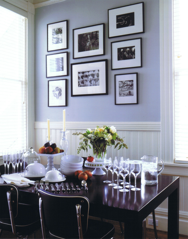 This is an example of an eclectic dining room in San Francisco with purple walls.