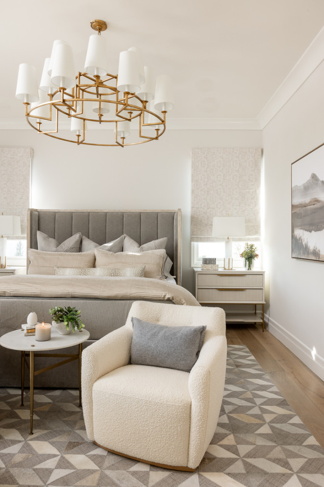 Mid-sized transitional master light wood floor and beige floor bedroom photo in Orange County with white walls
