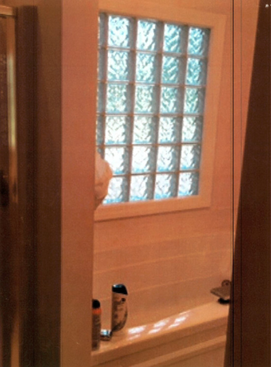 Small transitional master gray tile and porcelain tile vinyl floor and brown floor alcove shower photo with shaker cabinets, white cabinets, a two-piece toilet, blue walls, a vessel sink and quartz countertops
