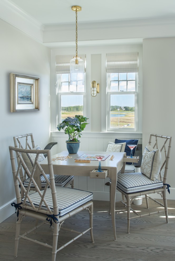 Design ideas for a small beach style separate dining room in Boston with grey walls and light hardwood floors.