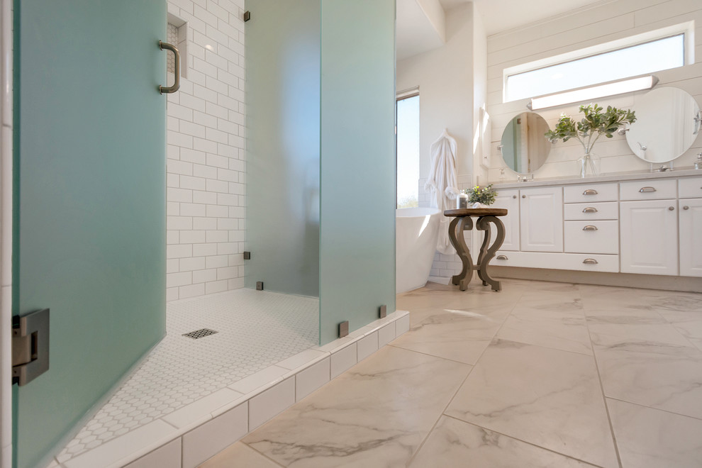 Mid-sized transitional master white tile and subway tile porcelain tile and white floor freestanding bathtub photo in Phoenix with a hinged shower door